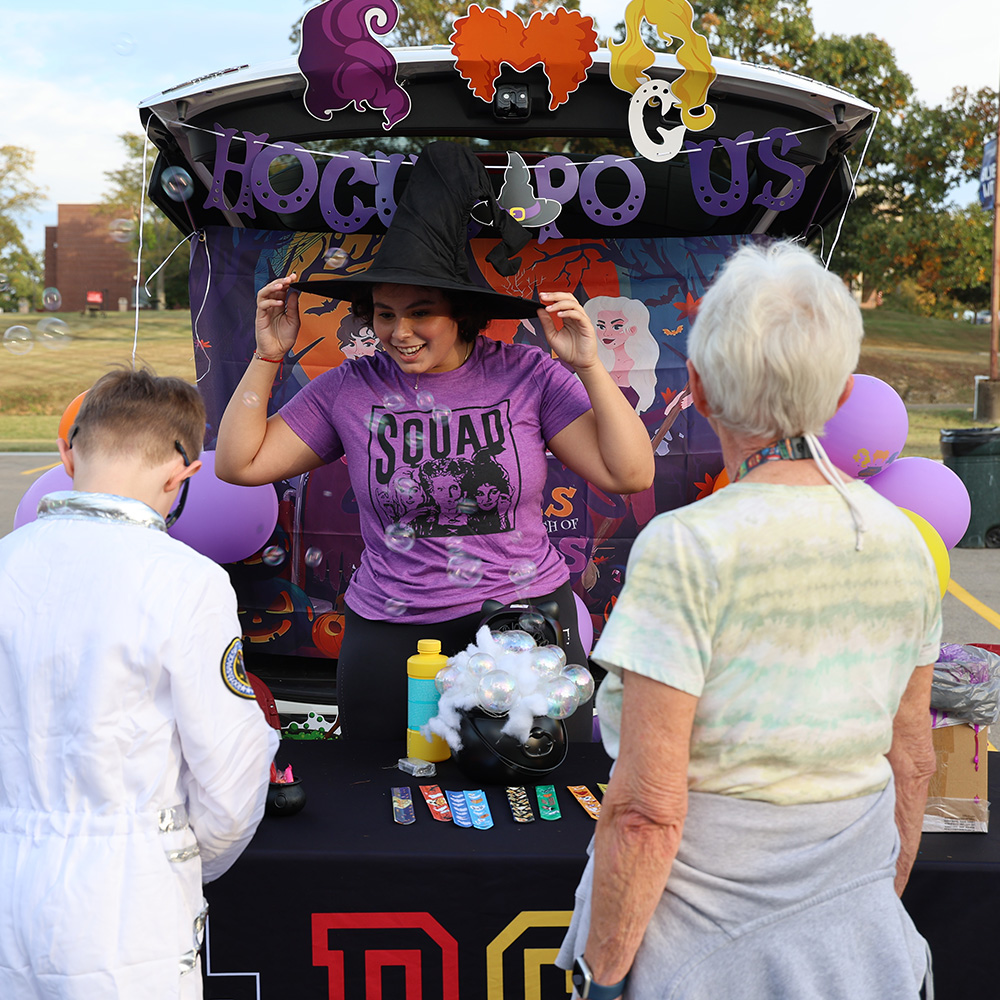 Student having a booth at the Trunk or Treat from 2025